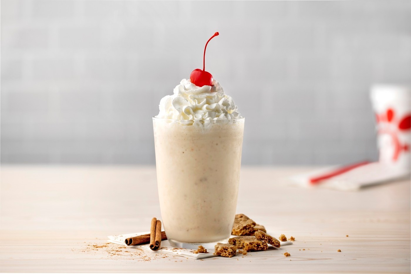Autumn Spice Milkshake with cinnamon sticks and crunchy bits of brown sugar cookies.