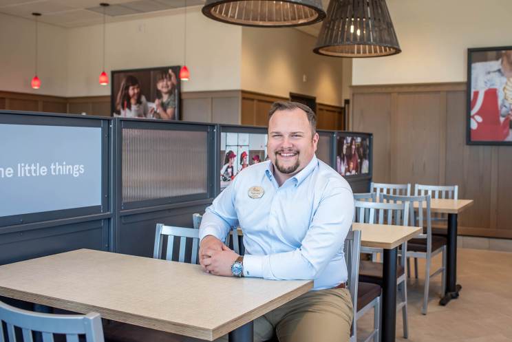 Bradley Bache at a table inside of Chick-fil-A.