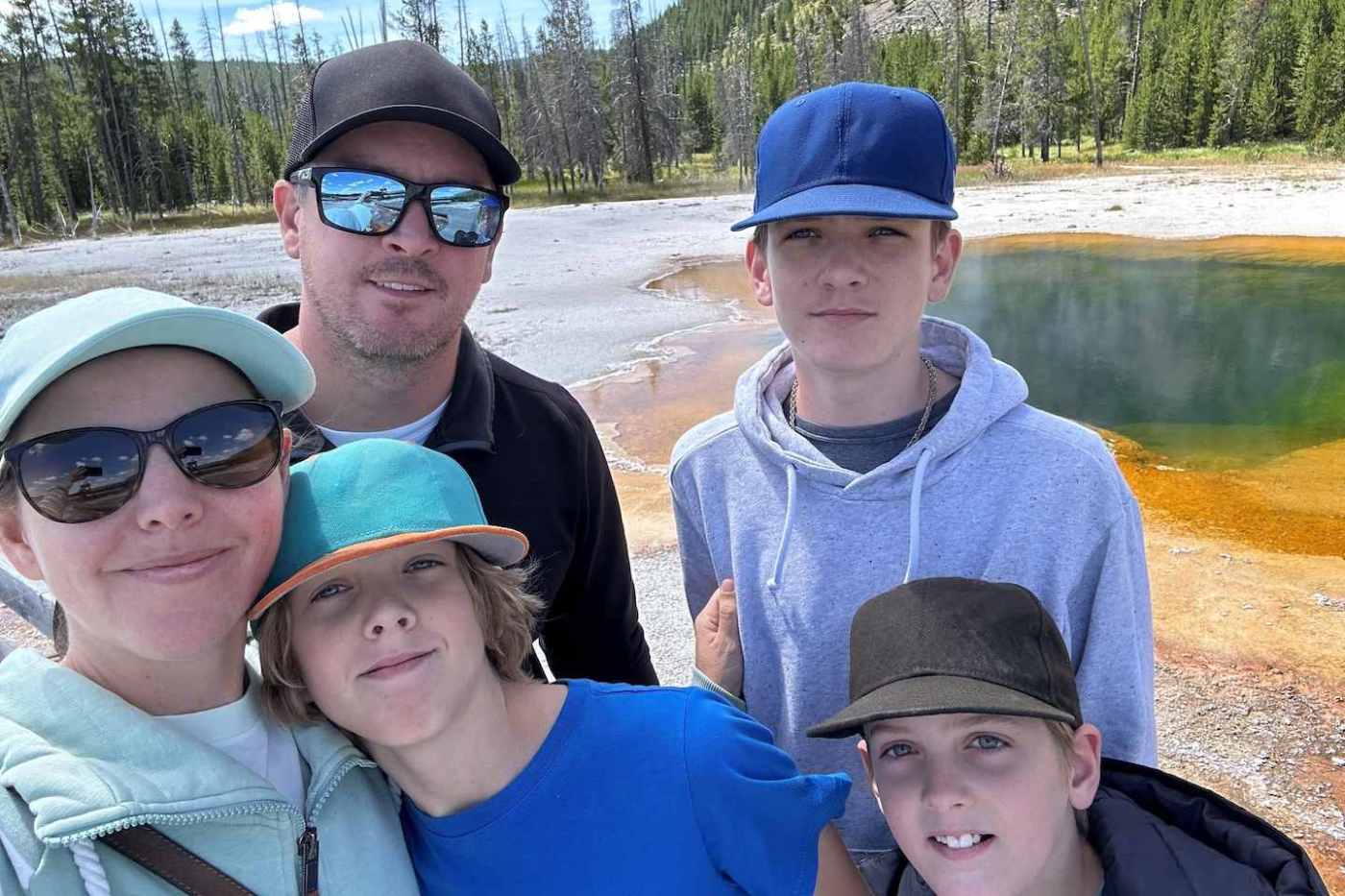 Rob Bourassa and his family, outdoors.