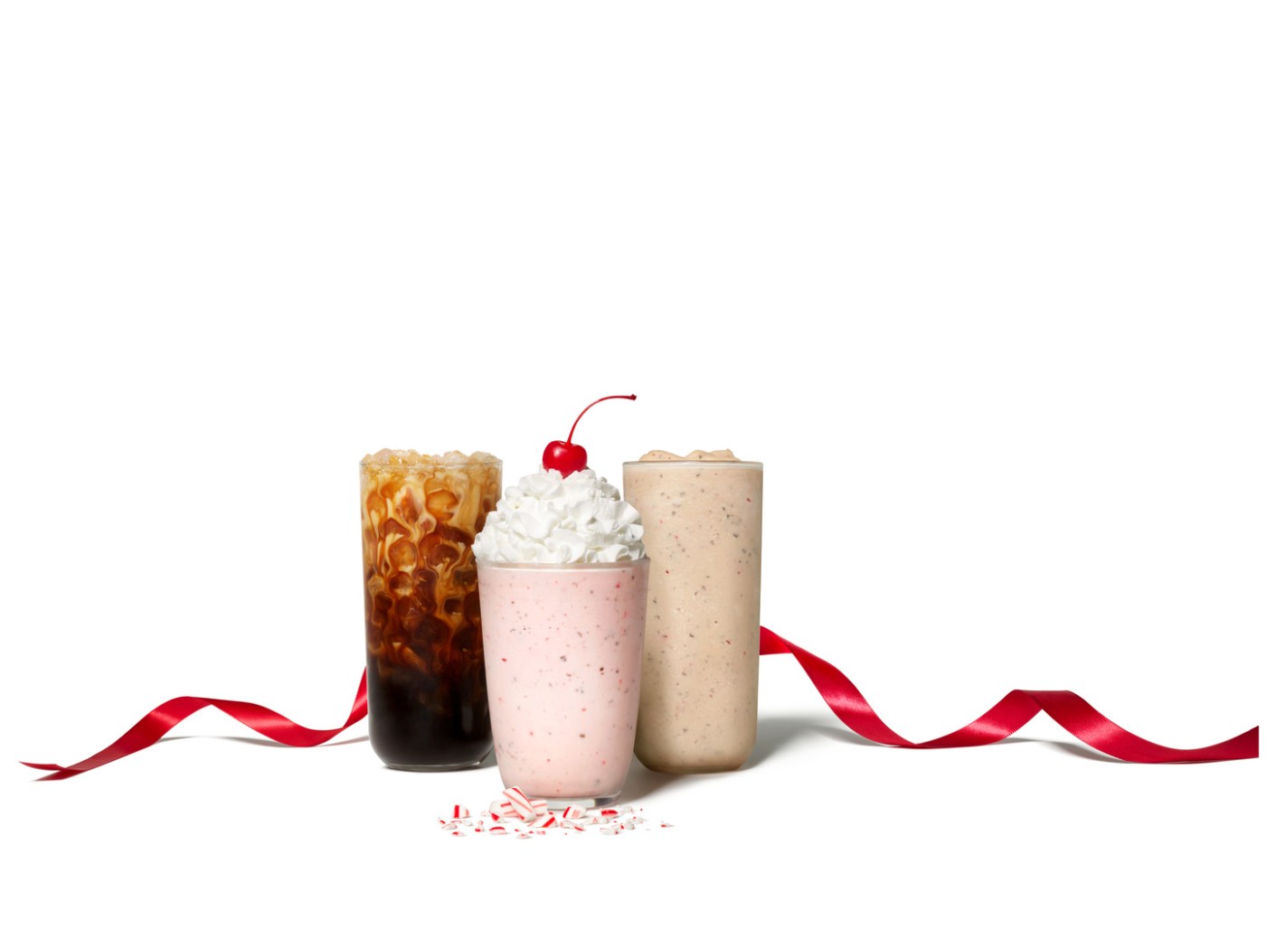 Three featured Peppermint Drinks with a red holiday ribbon.