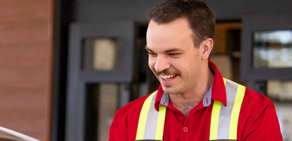 "A Team Member standing outside a Chick-fil-A Restaurant"