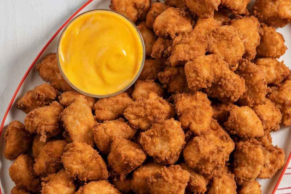 A platter of Chick-fil-A nuggets with dipping sauce.