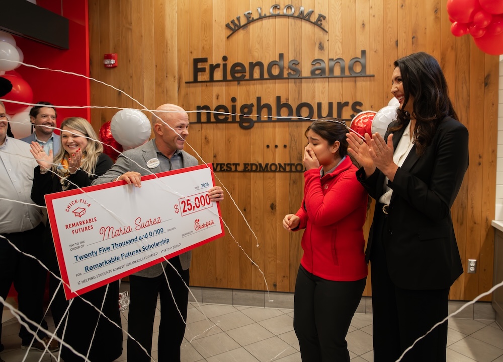 Maria Suarez, Chick-fil-A Canada's Newest Remarkable Futures™ Scholarships Recipient, accepting her check.