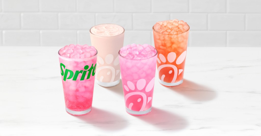 Four Pineapple Dragonfruit beverages sitting on a table.