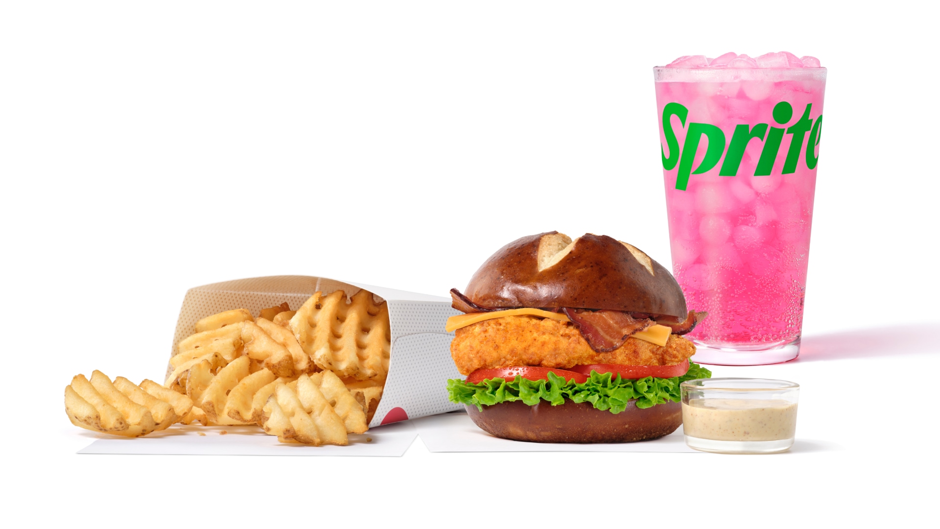 Tender, juicy chicken with crispy bacon and cheddar. All on a soft pretzel bun. 