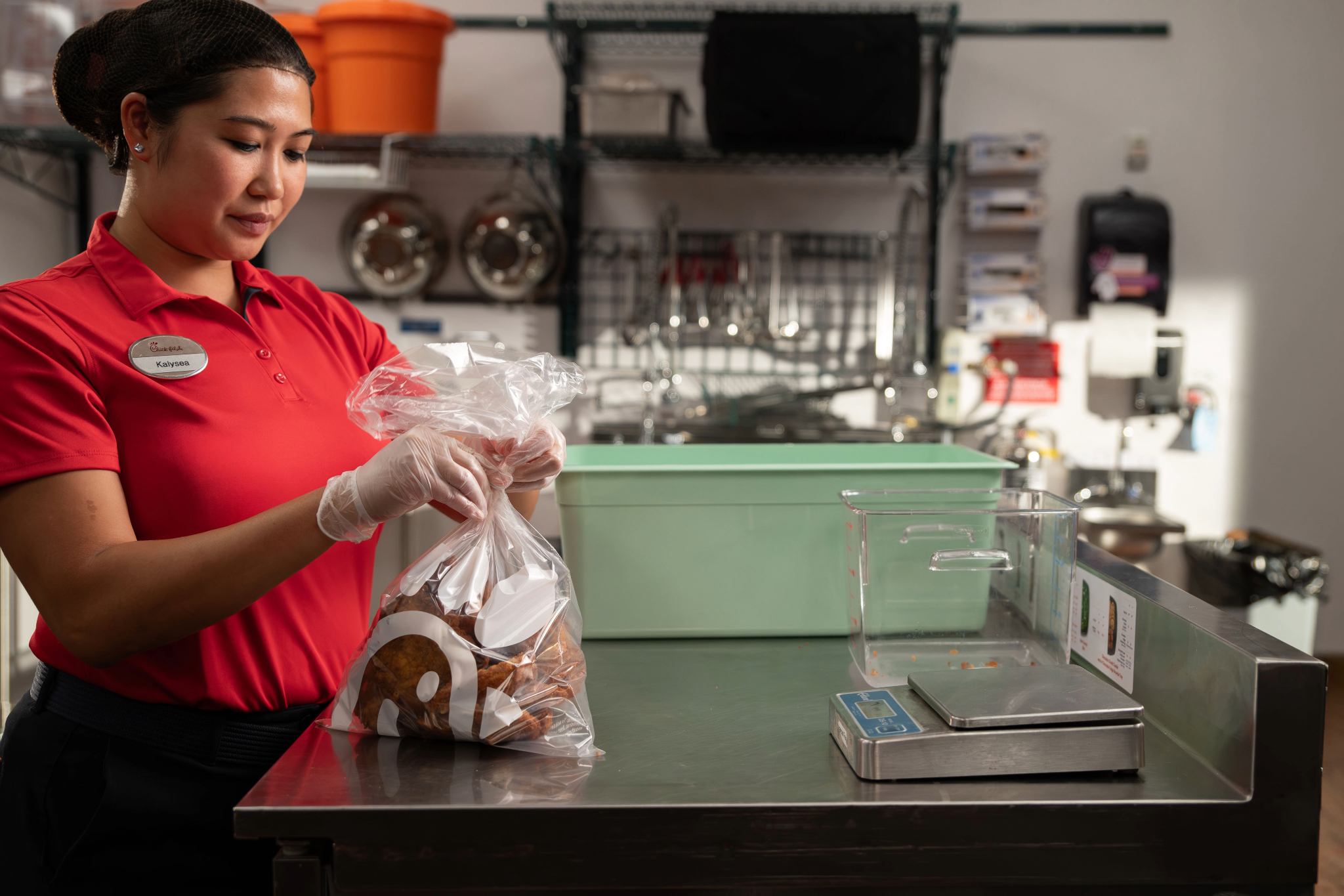 Chick-fil-A Team Member prepping food for Shared Table.